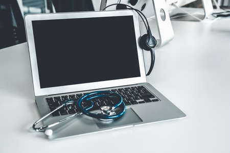 Headset and doctor equipment at clinic ready for actively support for patient by online video call . Concept of telehealth and telemedicine service .の写真素材