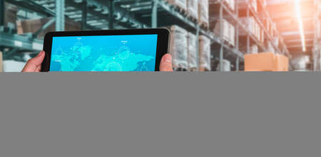 Warehouse management innovative software in computer for real time monitoring of goods package delivery . Computer screen showing smart inventory dashboard for storage and supply chain distribution .の写真素材