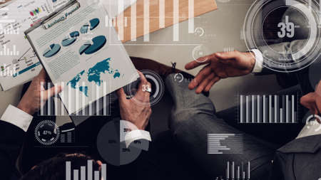 Conceptual vision of business people in corporate staff meeting . Concept of digital technology for marketing data analysis and investment decision making .の写真素材