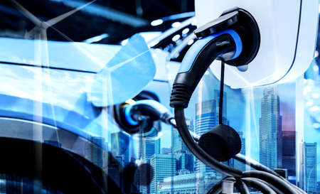 EV charging station for electric car in concept of green energy and eco power produced from sustainable source to supply to charger station in order to reduce CO2 emission .の写真素材