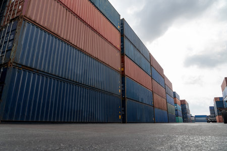 Cargo container for overseas shipping in shipyard with heavy machine . Logistics supply chain...