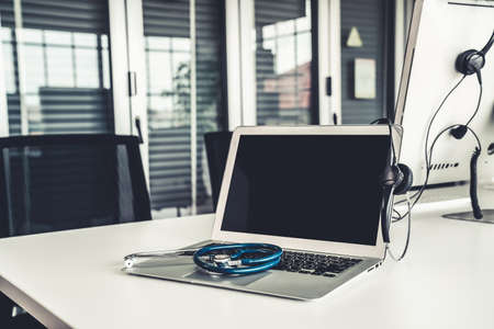 Headset and doctor equipment at clinic ready for actively support for patient by online video call . Concept of telehealth and telemedicine service .の写真素材