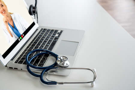 Telemedicine service online video call for doctor to actively chat with patient via remote healthcare consultant software . People can use app to contact doctors for virtual meeting from home .の写真素材