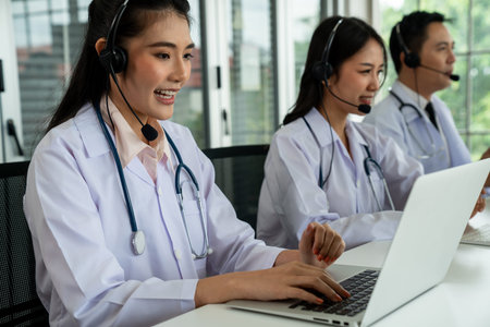 Doctor team wearing headset talking actively on video call in hospital clinic . Concept of...
