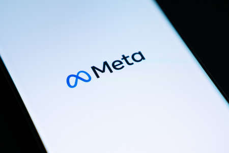Bangkok, Thailand - October 29, 2021: Meta logo is shown on a device screen. Meta is the new corporate name of Facebook. Social media platform will change to Meta to emphasize its metaverse vision.のeditorial素材