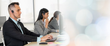 Business people wearing headset working in office to support remote customer or colleague. Call...