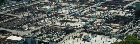 Large construction site with heavy construction machinery in metropolis captured during the early stage of mega construction project .の写真素材