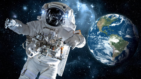 Astronaut spaceman do spacewalk while working for spaceflight mission at space station . Astronaut wear full spacesuit for operation .の写真素材