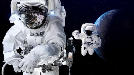 Astronaut spaceman do spacewalk while working for spaceflight mission at space station . Astronaut wear full spacesuit for operation .の写真素材