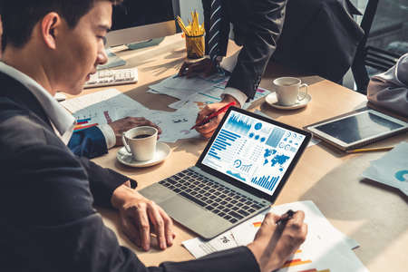 Business data dashboard analysis by ingenious computer software . Investment application display business sales and profit on the computer screen and advise marketing planning decision .の写真素材