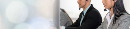 Call center or customer support agent in broaden view panorama banner wearing headset while working at office to support remote customer or colleague on telephone video conference callの写真素材