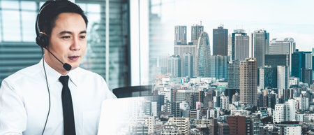 Businessman wearing headset working actively in office . Call center, telemarketing, customer...