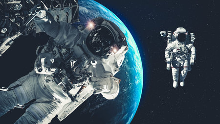 Astronaut spaceman do spacewalk while working for spaceflight mission at space station . Astronaut...