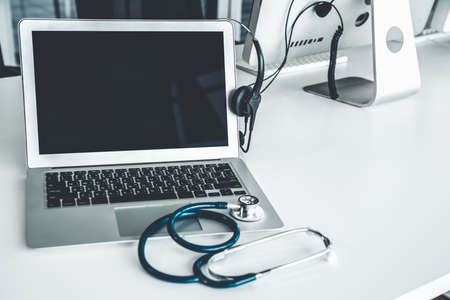 Headset and doctor equipment at clinic ready for actively support for patient by online video call . Concept of telehealth and telemedicine service .の写真素材