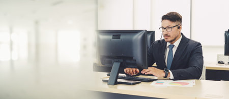 Business people wearing headset working in office to support remote customer or colleague. Call...