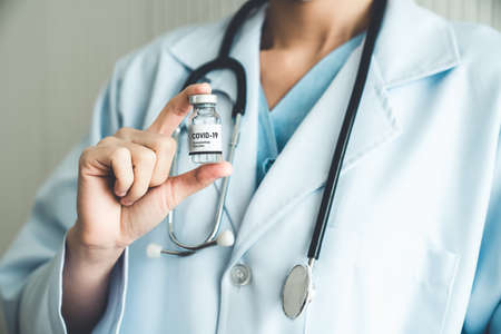 Skillful doctor prepare vaccine proficiently before injection . Covid 19 and coronavirus vaccination center service concept .の写真素材