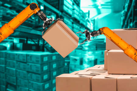 Smart robot arm system for innovative warehouse and factory digital technology . Automation manufacturing robot controlled by industry engineering using IOT software connected to internet network .の写真素材