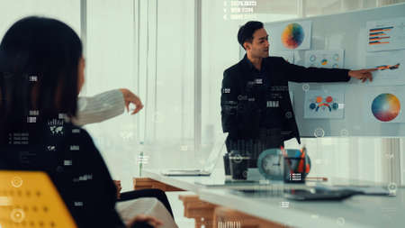 Business people in corporate staff meeting with envisional graphic . Concept of digital technology for marketing data analysis and investment decision making .の写真素材