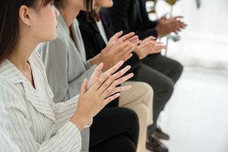 Businesswoman proficiently present work project receive celebrations from team . Corporate business team collaboration concept .の写真素材