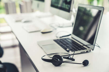 Headset and customer support equipment at call center ready for actively service . Corporate business help desk and telephone assistance concept .の写真素材