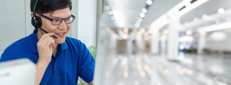 Business people wearing headset working in office in widen view to support remote customer or...