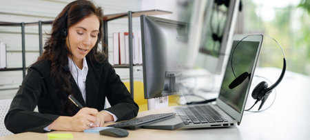 Business people wearing headset working in office to support remote customer or colleague. Call...