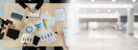 Business people group meeting shot from top widen view in office . Profession businesswomen, businessmen and office workers working in team conference with project planning document on meeting table .の写真素材