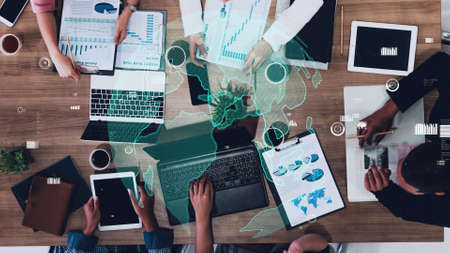 Conceptual vision of business people in the corporate staff meeting . Concept of digital technology for marketing data analysis and investment decision making .の写真素材