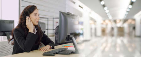 Business people wearing headset working in office to support remote customer or colleague. Call center, telemarketing, customer support agent provide service in broaden view .の写真素材