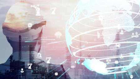 Future factory plant and inventive energy industry concept in creative graphic design. Oil, gas and petrochemical refinery factory with hologram showing next generation of power and energy business.の写真素材