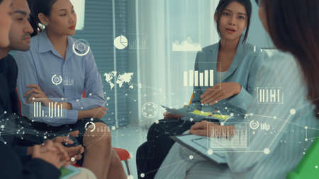Business people in corporate staff meeting with envisional graphic . Concept of digital technology for marketing data analysis and investment decision making .の写真素材
