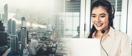 Businesswoman wearing headset working actively in office . Call center, telemarketing, customer...