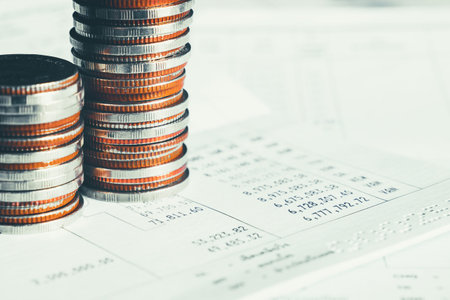 Pile of gold coins stack in finance treasury deposit bank account for saving . Concept of corporate...