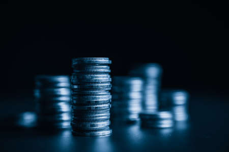 Pile of gold coins stack in finance treasury deposit bank account for saving . Concept of corporate business economy and financial growth by investment in valuable asset to gain cash revenue profit .の写真素材