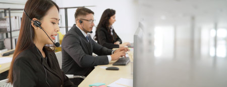Business people wearing headset working in office to support remote customer or colleague. Call...
