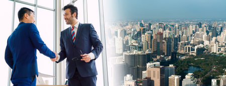 Business people handshake in corporate office in widen view showing professional agreement on a...