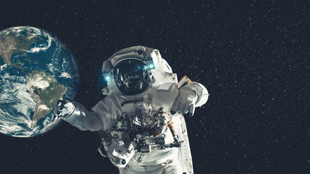 Astronaut spaceman do spacewalk while working for spaceflight mission at space station . Astronaut...