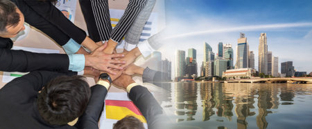 Happy business people celebrate teamwork success together with joy at office table shot from top...