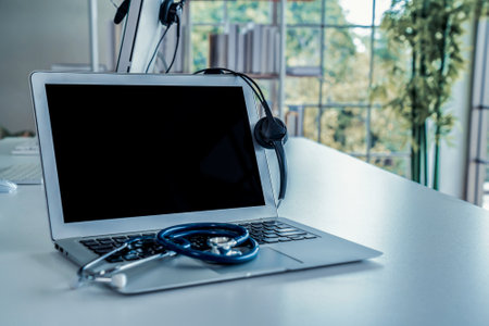 Headset and doctor equipment at clinic ready for actively support for patient by online video call . Concept of telehealth and telemedicine service .の写真素材