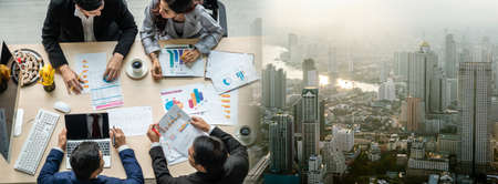 Business people group meeting shot from top widen view in office . Profession businesswomen, businessmen and office workers working in team conference with project planning document on meeting table .の写真素材