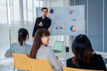 Business people proficiently discuss work project while sitting in circle . Corporate business team collaboration concept .の写真素材