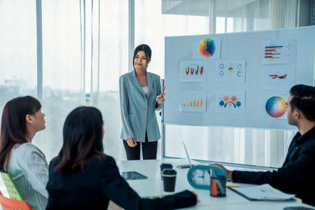 Business people proficiently discuss work project while sitting in circle . Corporate business team collaboration concept .の写真素材