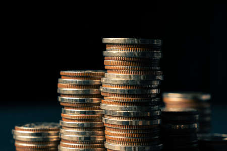 Pile of gold coins money stack in finance treasury deposit bank account saving . Concept of corporate business economy and financial growth by investment in valuable asset to gain cash revenue .の写真素材