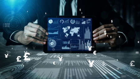 Big Data Technology for Business Finance Analytic conceptual. Modern graphic interface shows massive information of business sale report, profit chart and stock market analysis on screen monitor.の写真素材