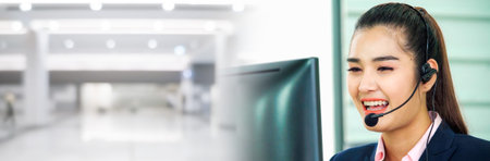 Business people wearing headset working in office in widen view to support remote customer or...