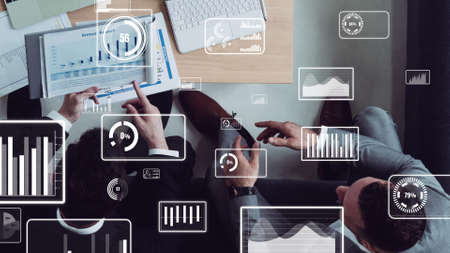 Conceptual vision of business people in corporate staff meeting . Concept of digital technology for marketing data analysis and investment decision making .の写真素材