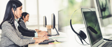 Business people wearing headset working in office to support remote customer or colleague. Call...