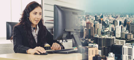 Business people wearing headset working in office to support remote customer or colleague. Call center, telemarketing, customer support agent provide service in broaden view .の写真素材