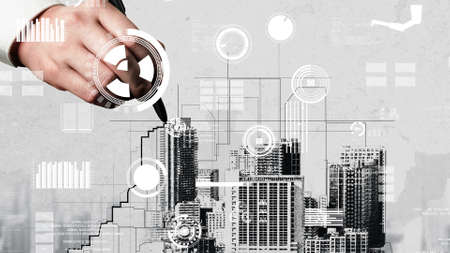 City civil planning and inventive real estate development . Architect people looking at abstract city sketch drawing to design creative future city building. Architecture dream and ambition concept.の写真素材