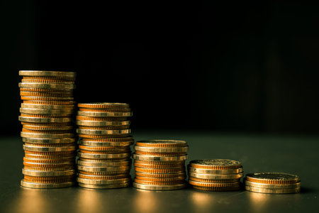 Pile of gold coins stack in finance treasury deposit bank account for saving . Concept of corporate...